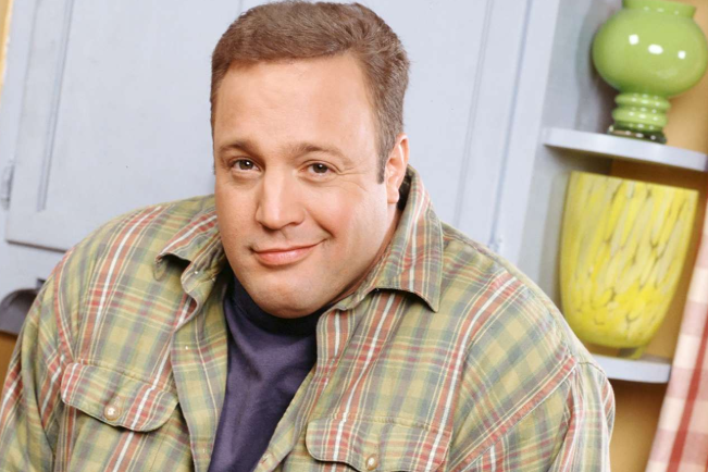 A professional portrait of actor and comedian Kevin James smiling during an interview.