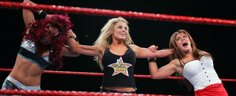 Trish Stratus' husband Ron Fisico standing with Trish Stratus at a public appearance showing their long-lasting relationship.