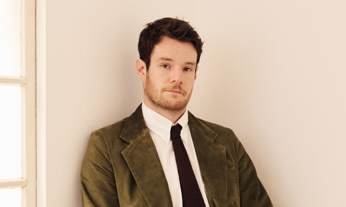 Connor Swindells true story showing British actor Connor Swindells in a professional portrait highlighting his acting career