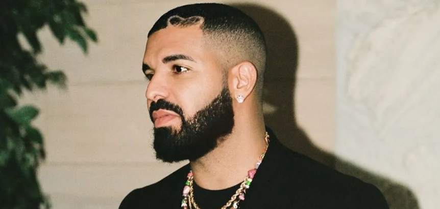 Drake performing on stage during a live concert