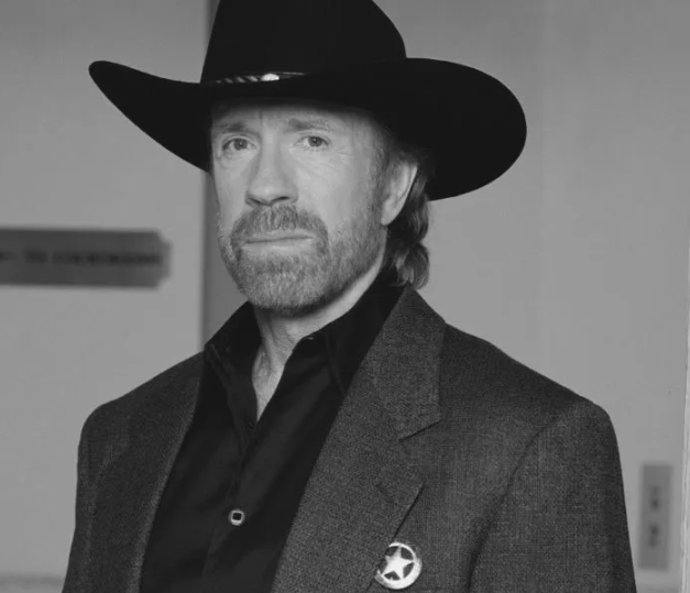 Young Chuck Norris in his traditional karate uniform, showing his World Karate Champion black belt form.