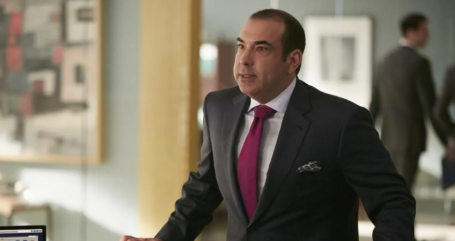 Rick Hoffman attending a professional event, showcasing his signature style and presence.
