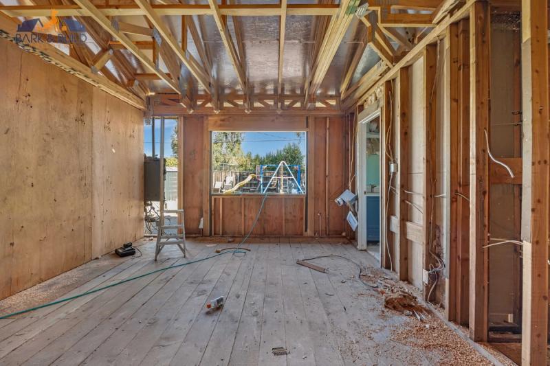 Fire-rated assembly — Type X gypsum and firestop sealant installation on shared wall