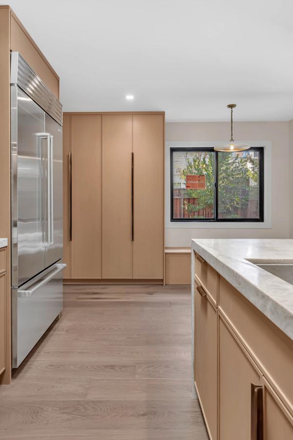Walk-in closet, wardrobe cabinetry detail with brushed hardware