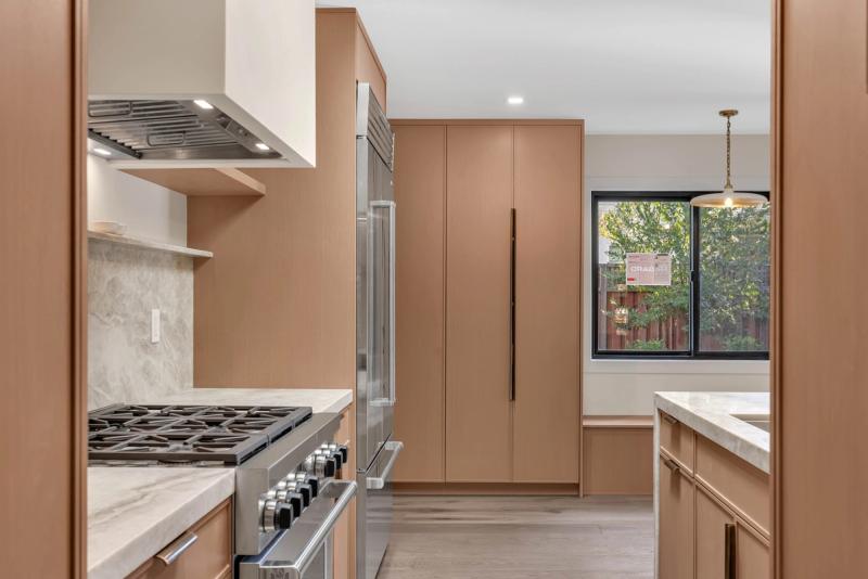 Kitchen, Wolf range with custom hood and floor-to-ceiling oak pantry cabinets