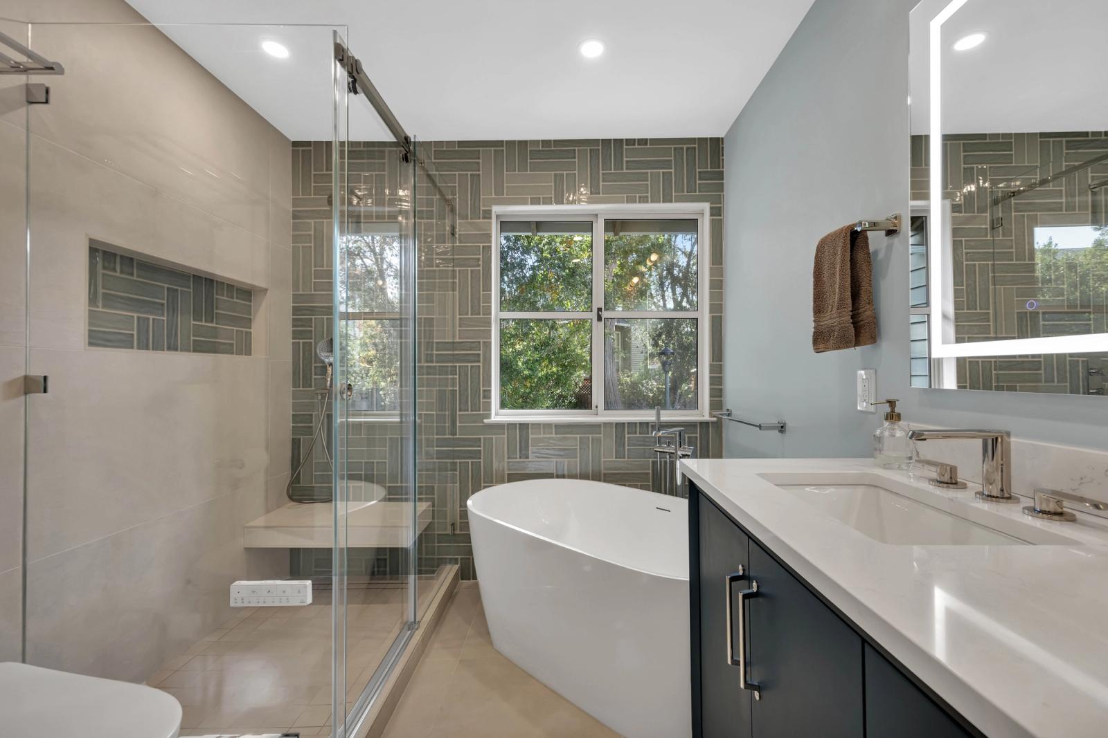 Master bathroom panoramic with custom tile and freestanding tub