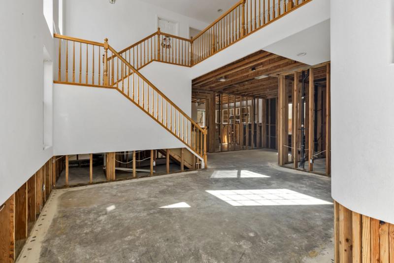 Foundation stabilization — steel pier underpinning for Peninsula home on Bay Mud