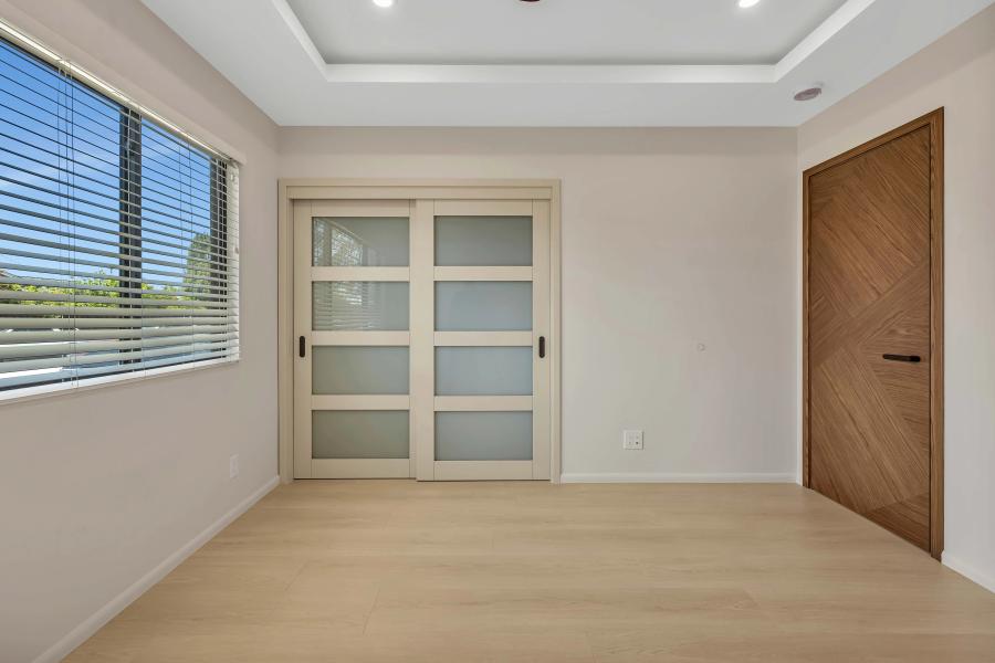 Fremont bedroom with frosted glass closet doors