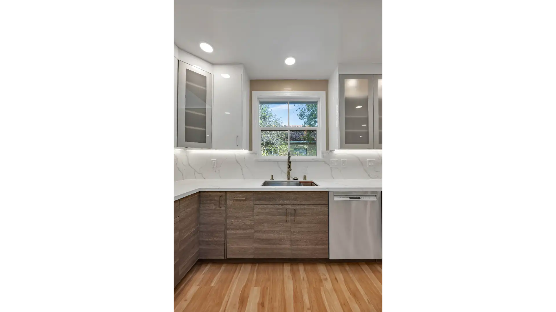 Kitchen space planning — natural stone and integrated appliances