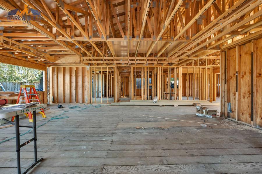 Interior JADU framing in progress — partition wall construction within existing home