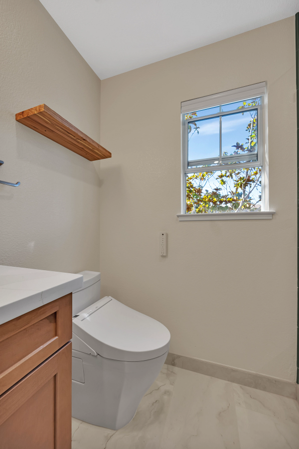 Shower bench detail, floating marble seat with brass glass hinges