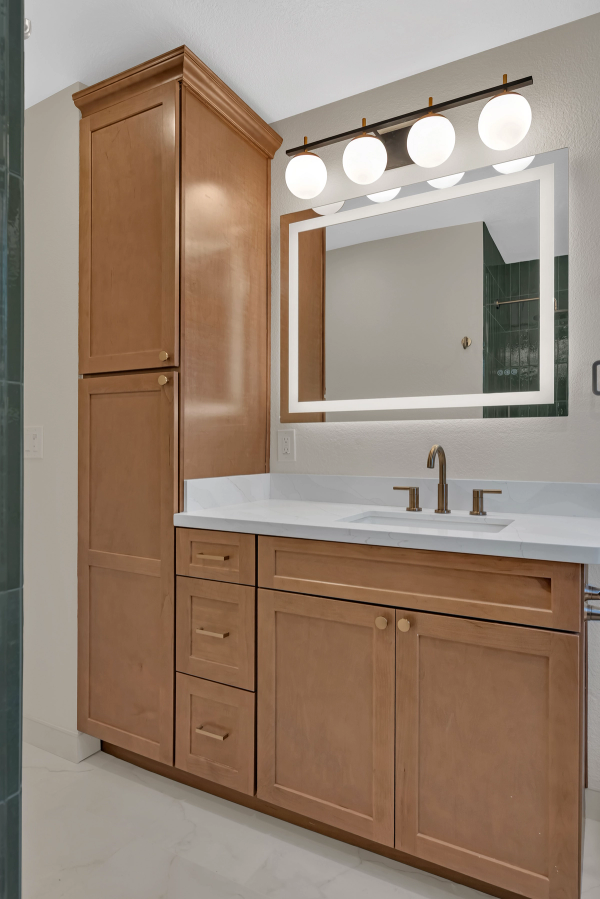 Guest bath, vanity with linen tower and LED mirror detail
