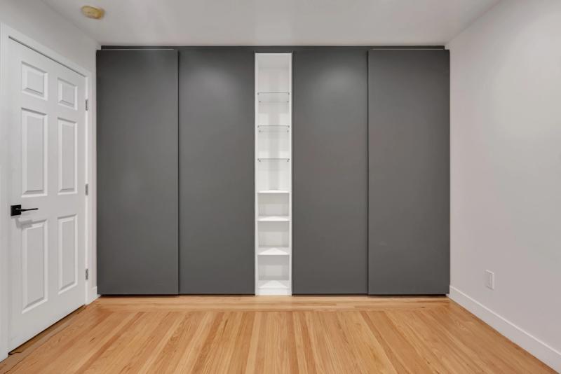 Walk-in closet, wide view with premium finishes