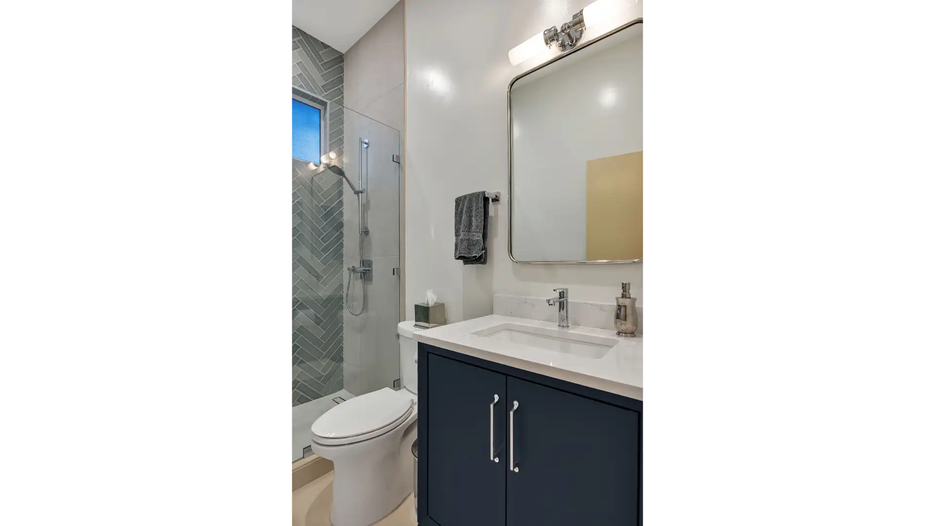 Spa-inspired master bathroom — natural stone, warm lighting, and organic materials