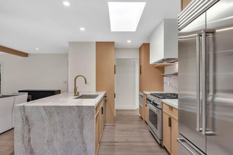 Kitchen, island counter detail with dishwasher and tall pantry cabinet
