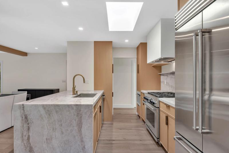 Kitchen, island counter detail with dishwasher and tall pantry cabinet