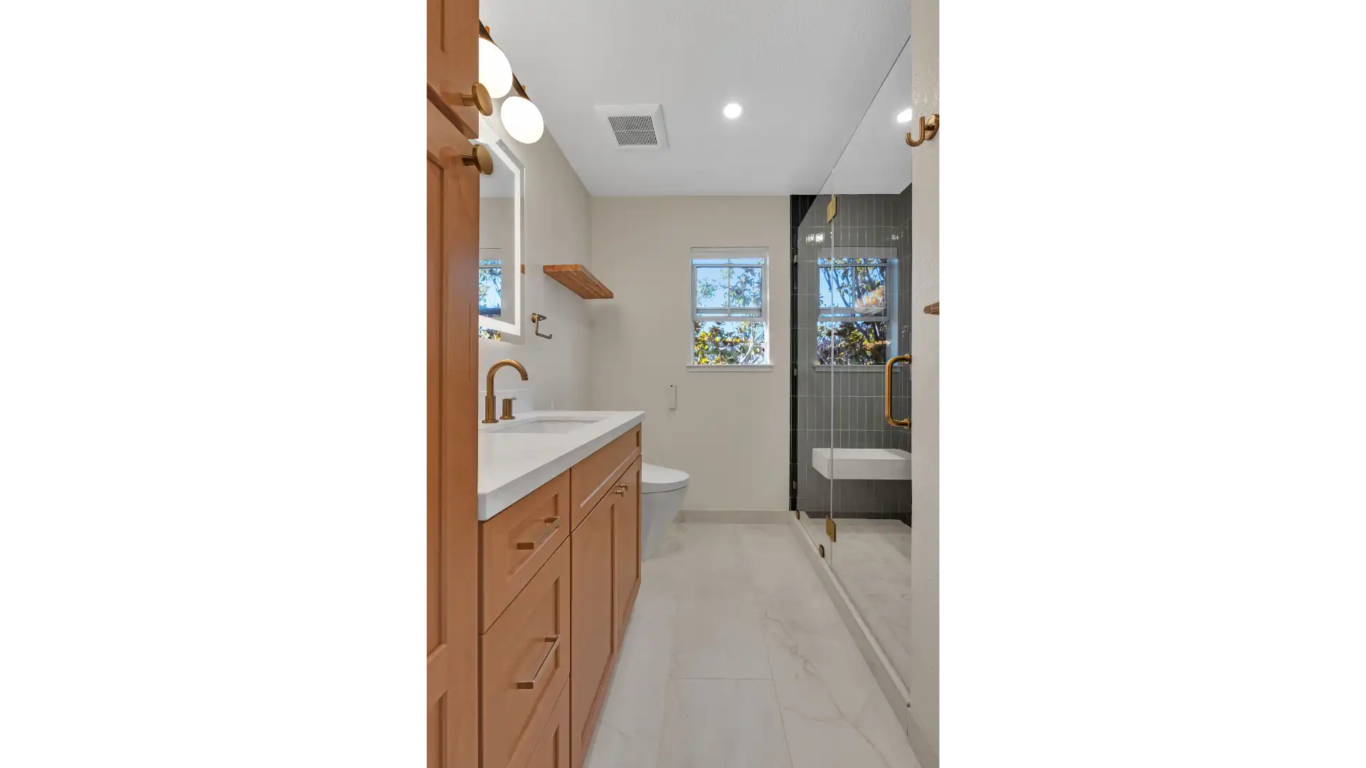 Bathroom before renovation — outdated fixtures and cramped layout