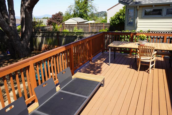 TREX deck — dining area with hillside view