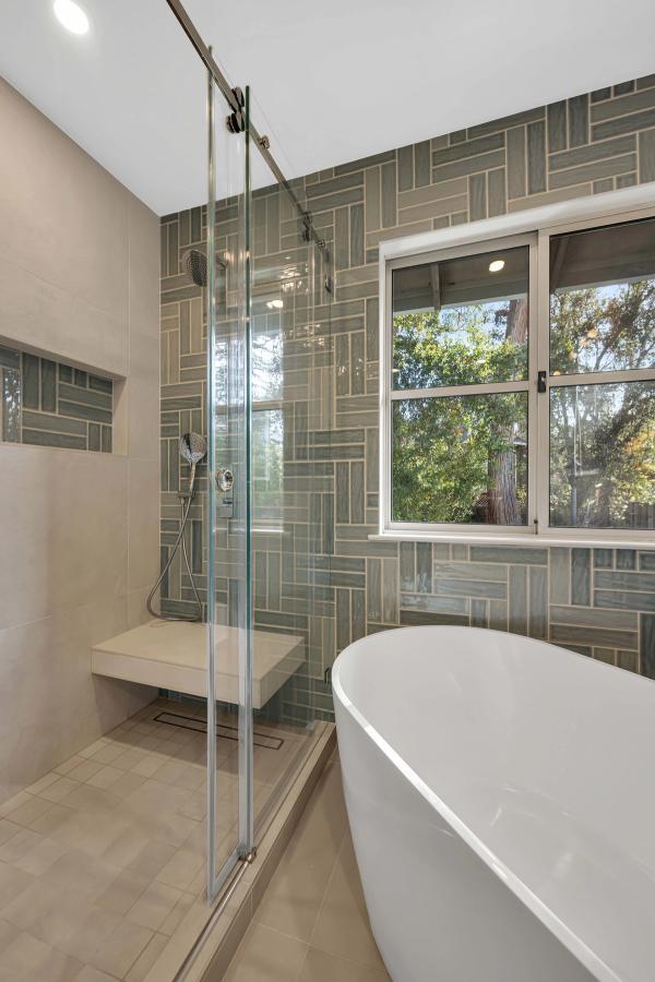 Master bath, shower glass and tub with natural light