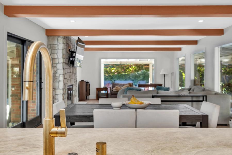 Completed Peninsula home interior — open-concept kitchen, living, and dining built by Bark and Build Builders