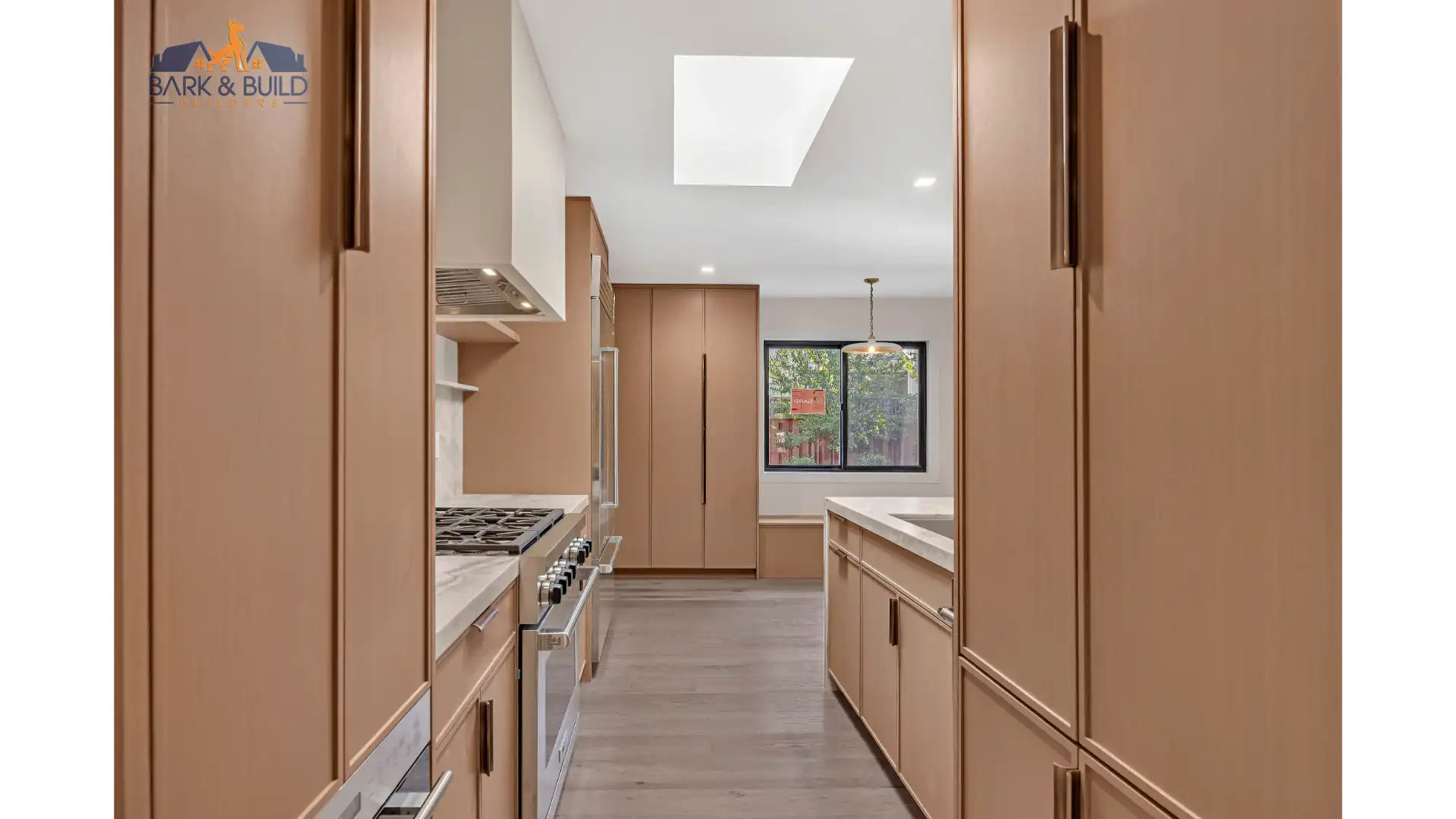 Wide view of a finished kitchen showing countertops, cabinetry, and overall design