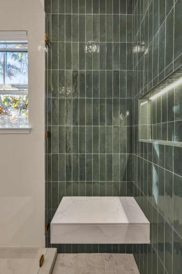 Shower interior, marble bench and vertical tile detail