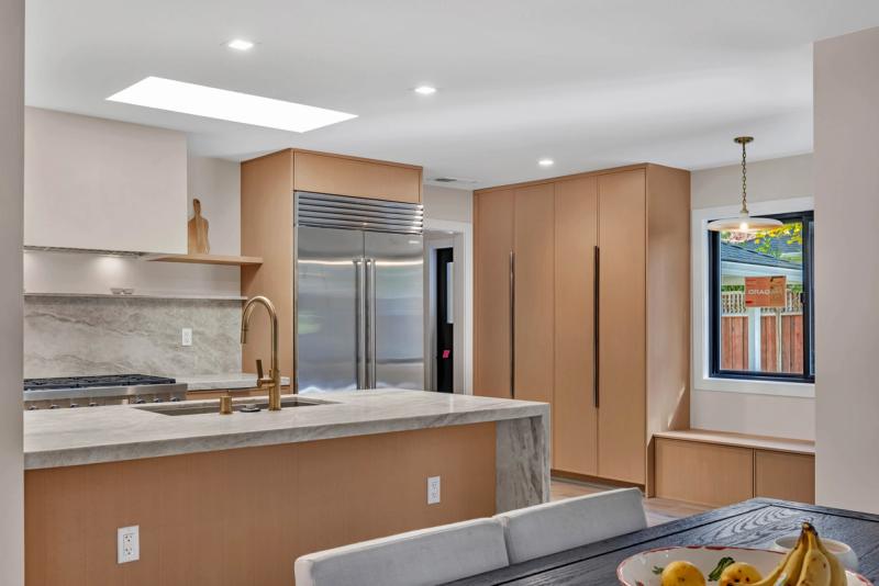 Kitchen, marble backsplash detail with open shelving and brass fixtures