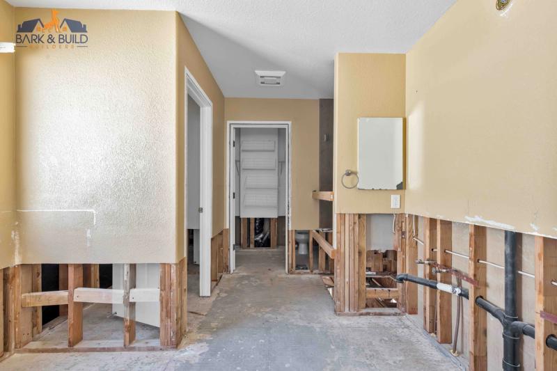 Sloped lot transformation — cut-and-fill grading for multi-level deck installation