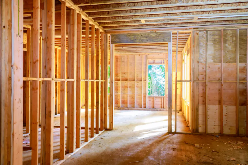 Stud framing for JADU partition wall — interior conversion in progress