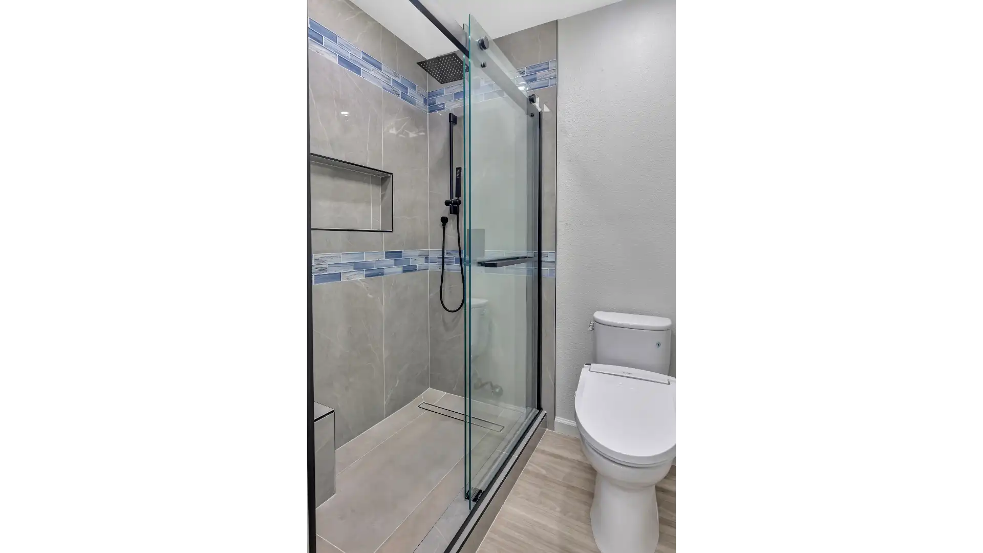 Floating vanity with stone countertop — structural mounting and large-format tile