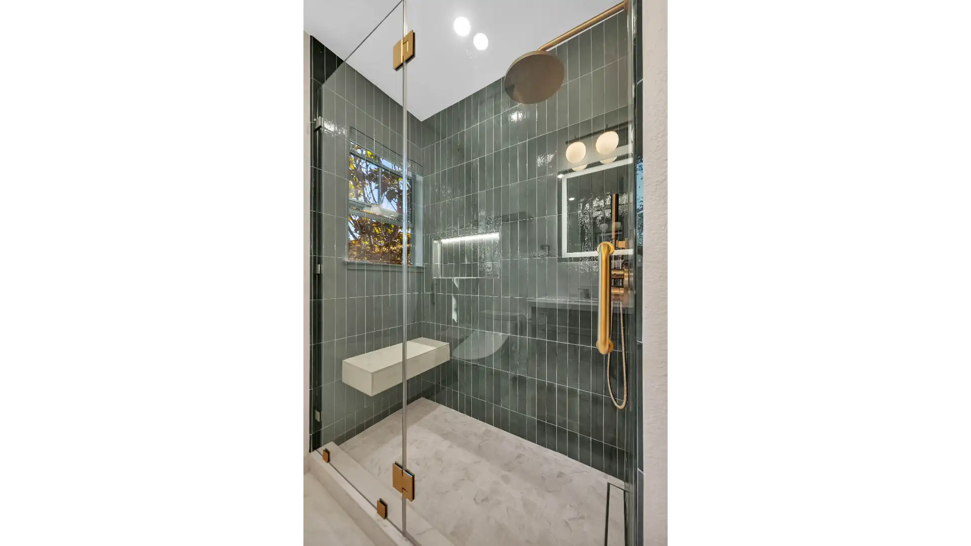 Accessible bathroom design — curbless shower with grab bars and non-slip flooring