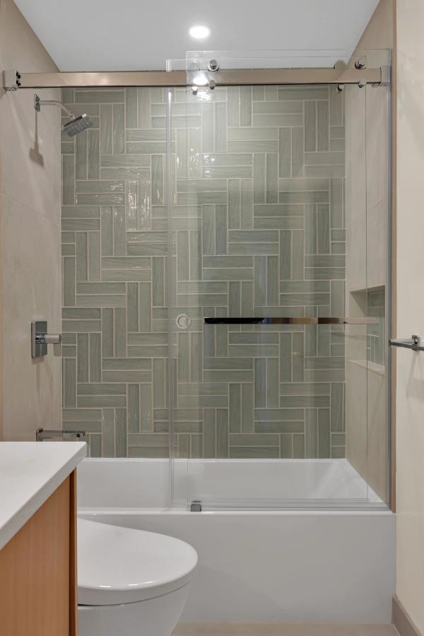 Hall bath, tub and shower detail with recessed niche