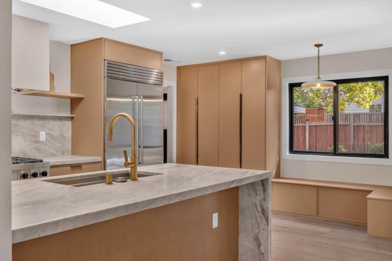 Kitchen, full view with skylight over island, Wolf range, and custom pantry