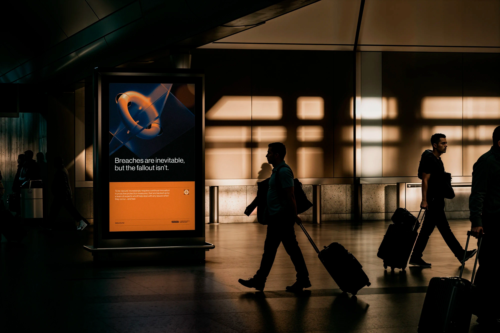 A portrait advertising billboard amongst a busy transit hub