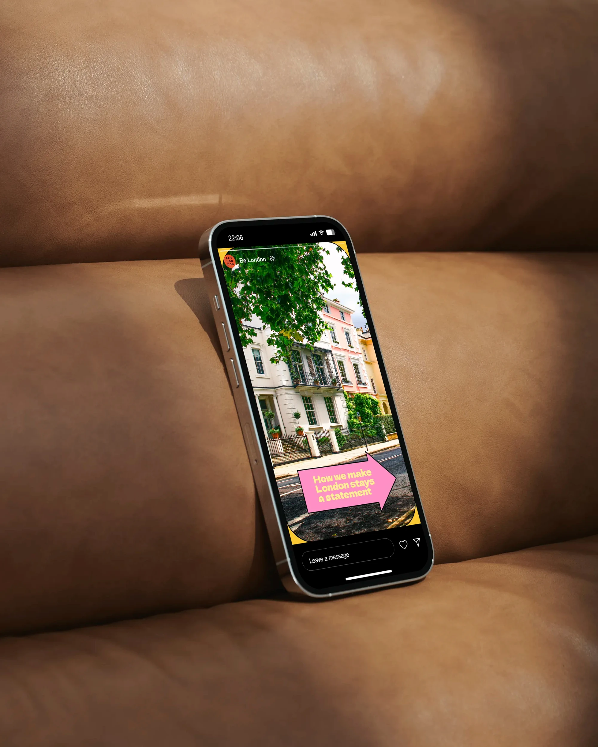 A social media post is visible on a brow leather chair.