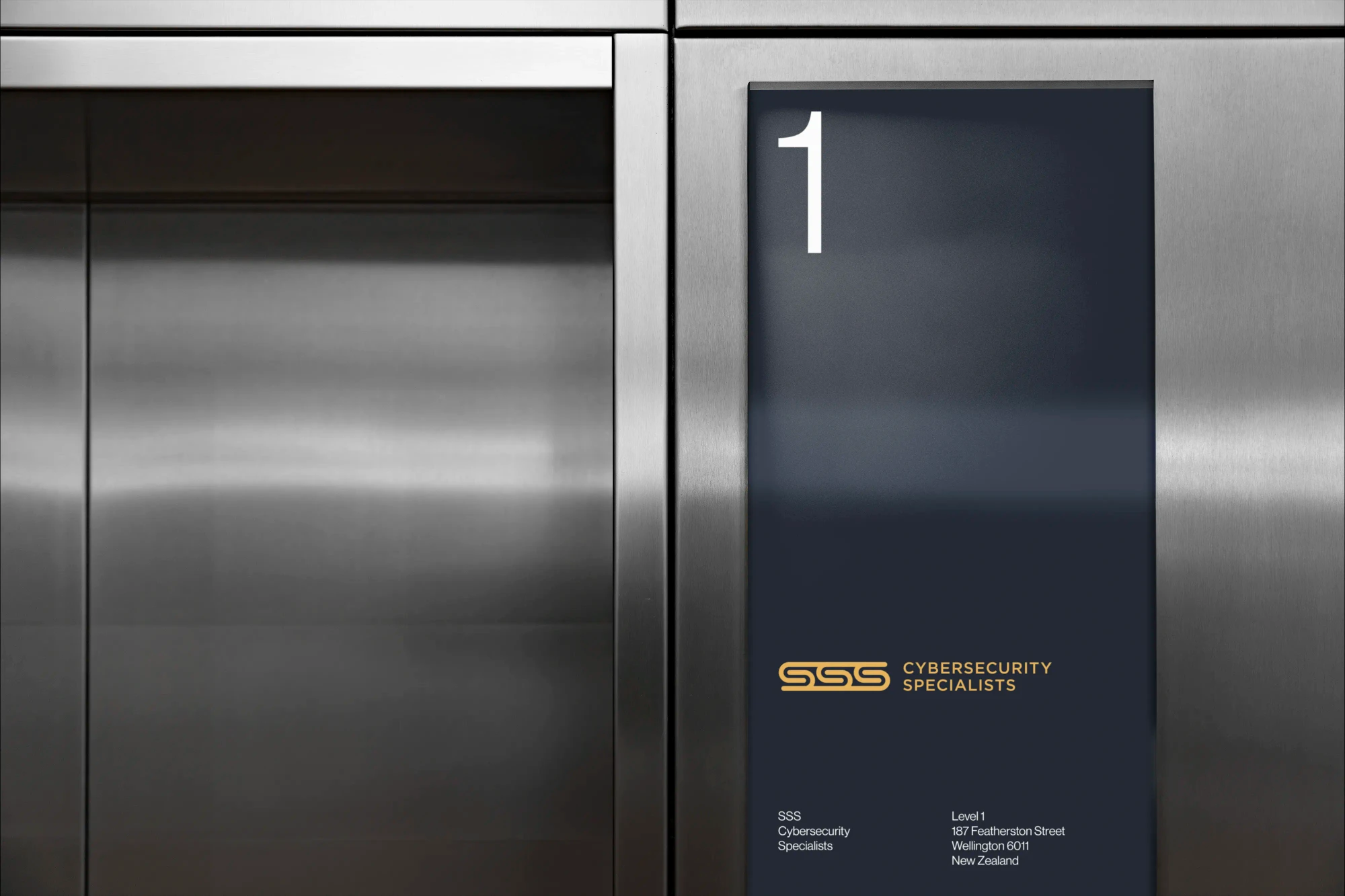 Triple-s graphics are displayed on a screen in an elevator