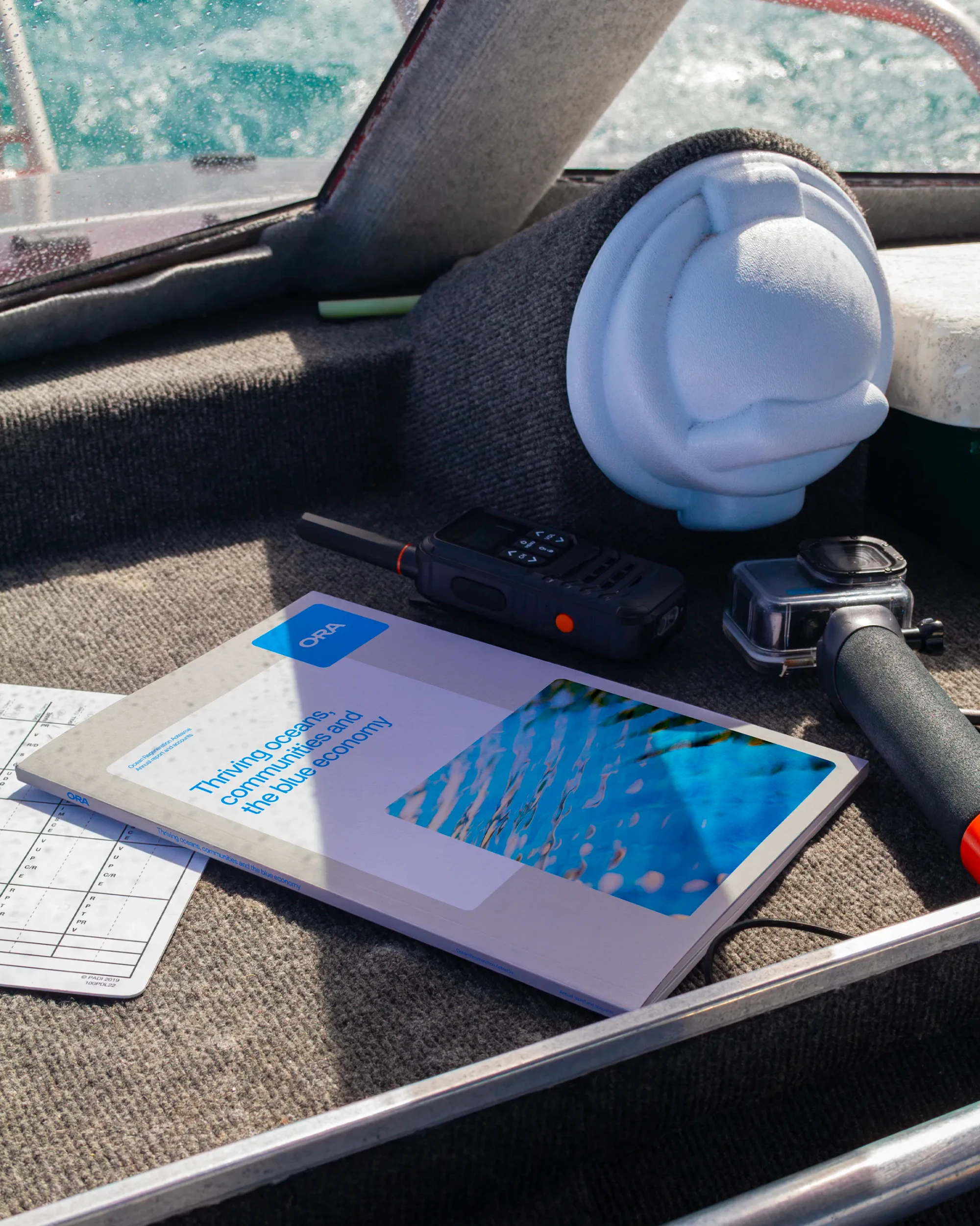 ORA's annual report book sits in a storage area on the diving boat.