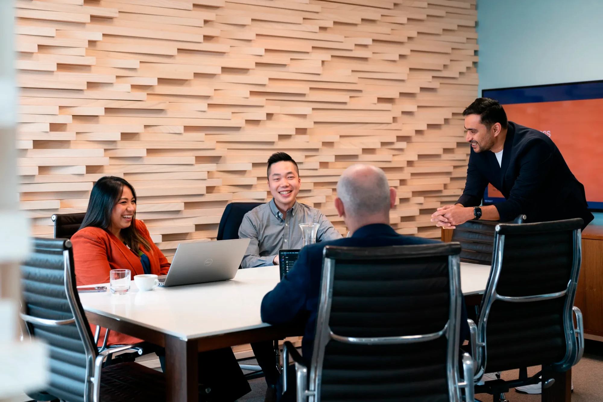 Some of the triple-s team discuss a project at the conference table