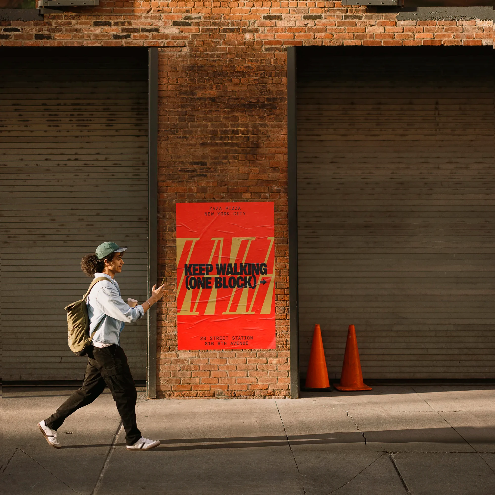 A pedestrian walks past a poster on the street.