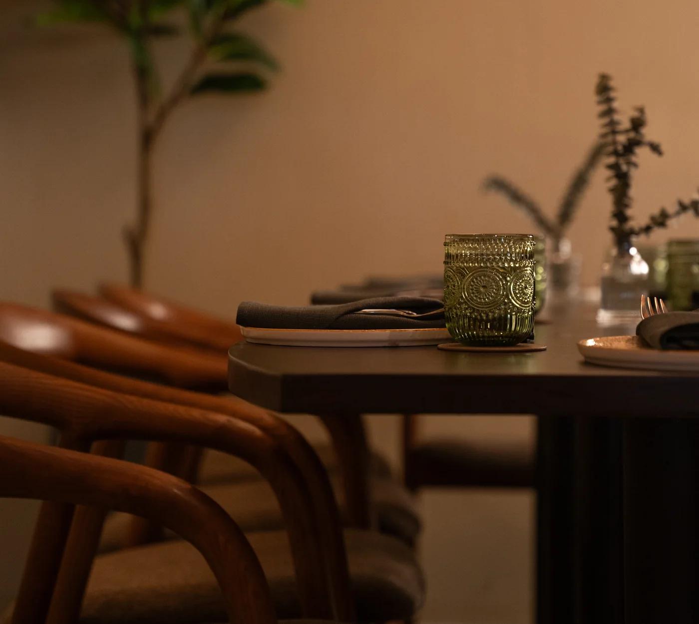 Two chairs beside a set table at Casa Mori