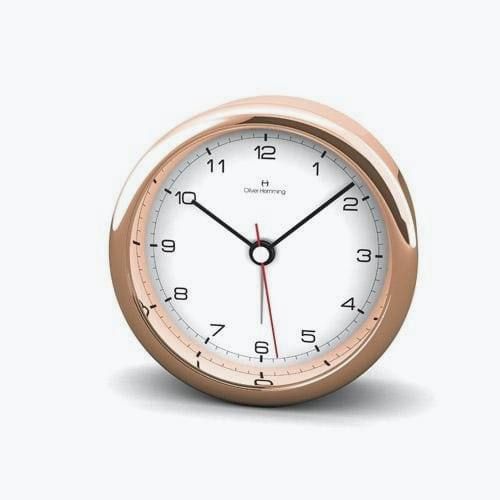 An Oliver Hemming Desire clock in rose gold
