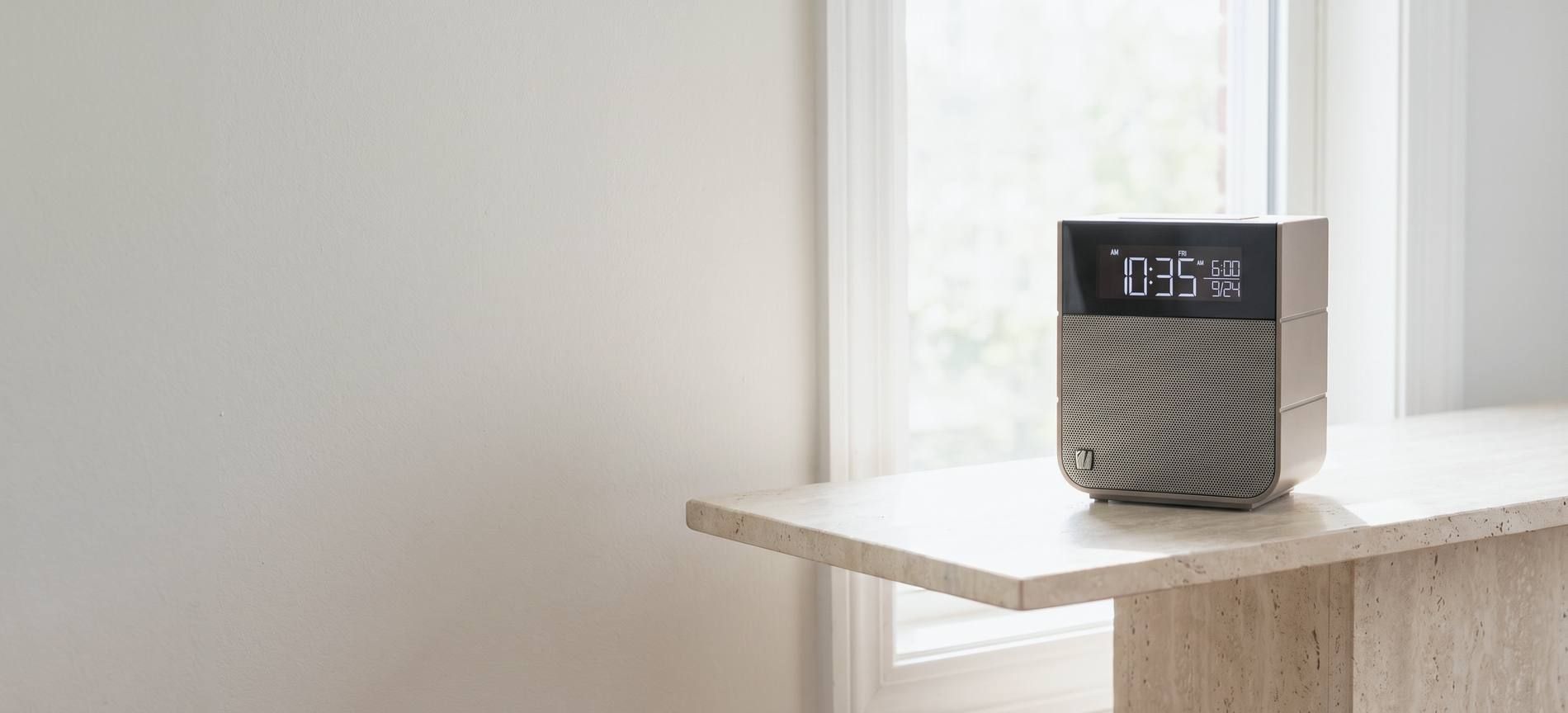 A Soundfreaq Sound Rise II on a stone plinth by a window in daylight