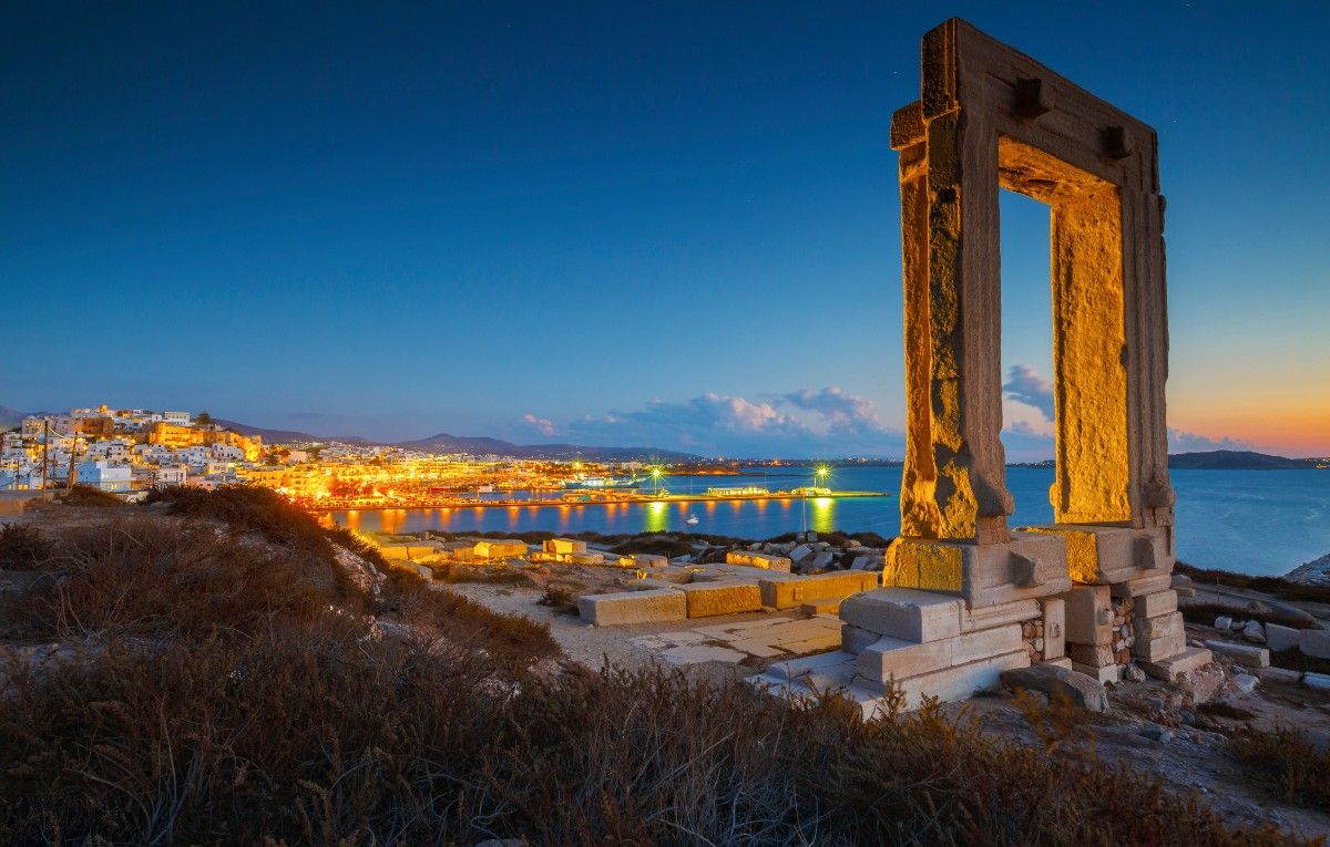View of Portara and remains of temple of Apollo at sunset.