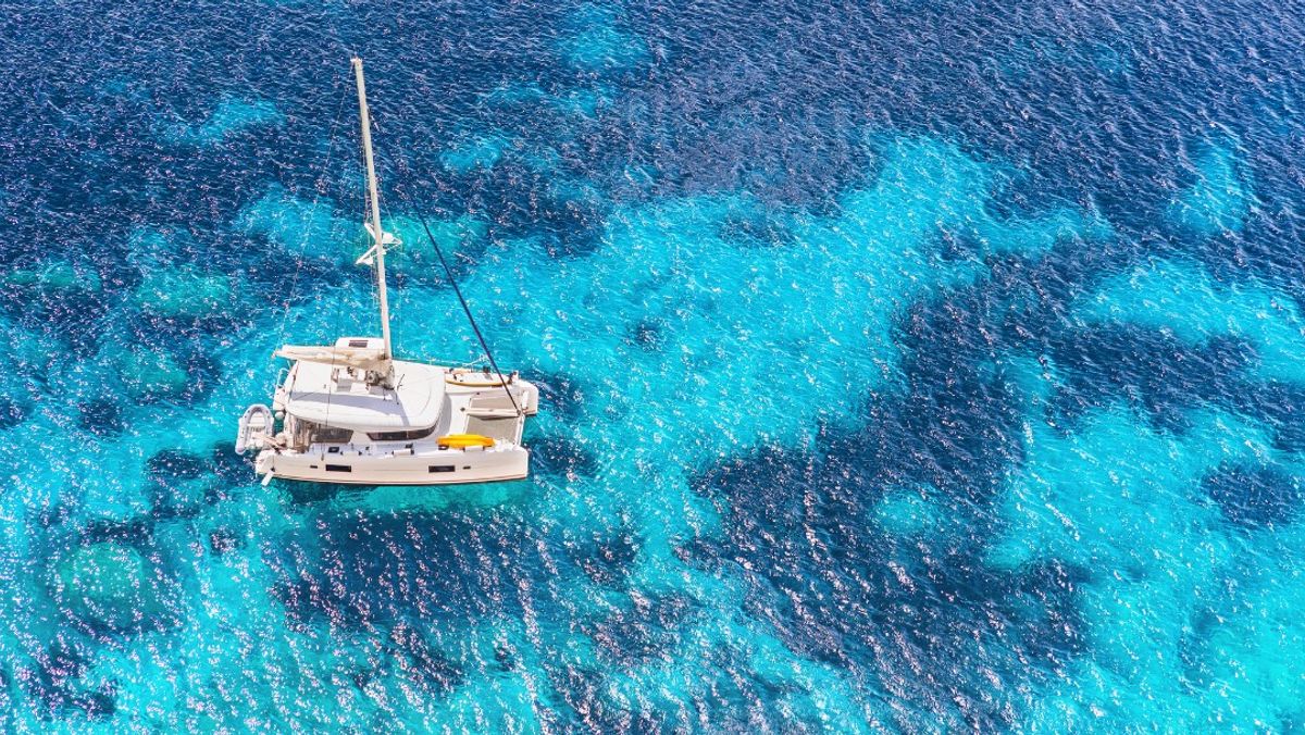 Sailboat yacht catamaran in beautiful Mediterranean bay
