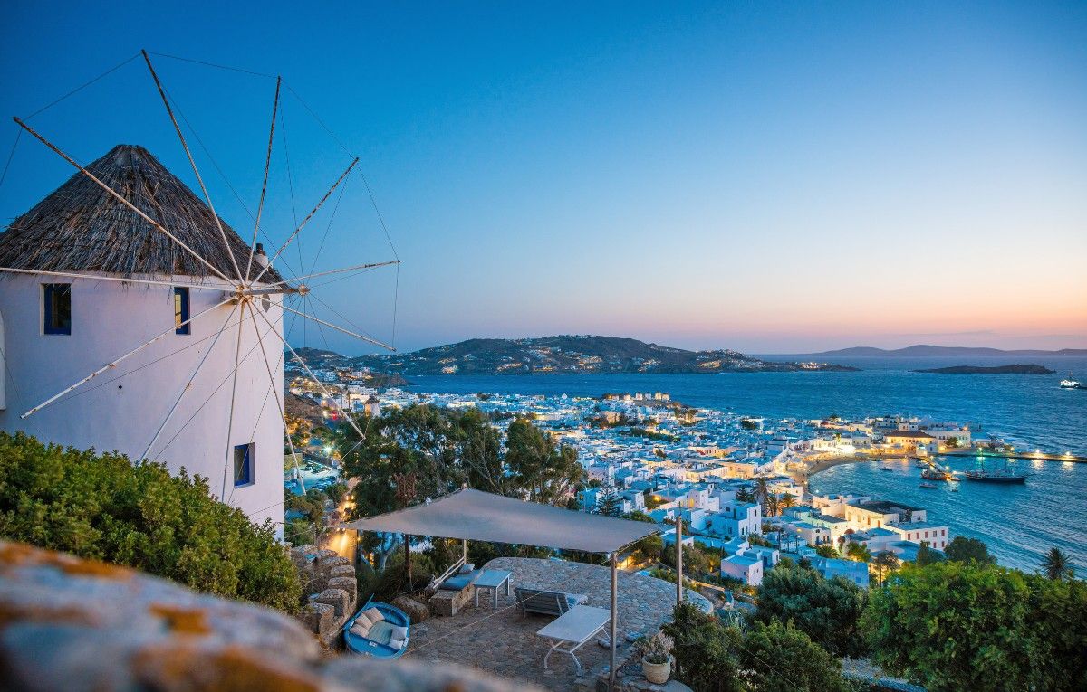Mykonos, Greece. Aerial view of windmills and Mykonos town.