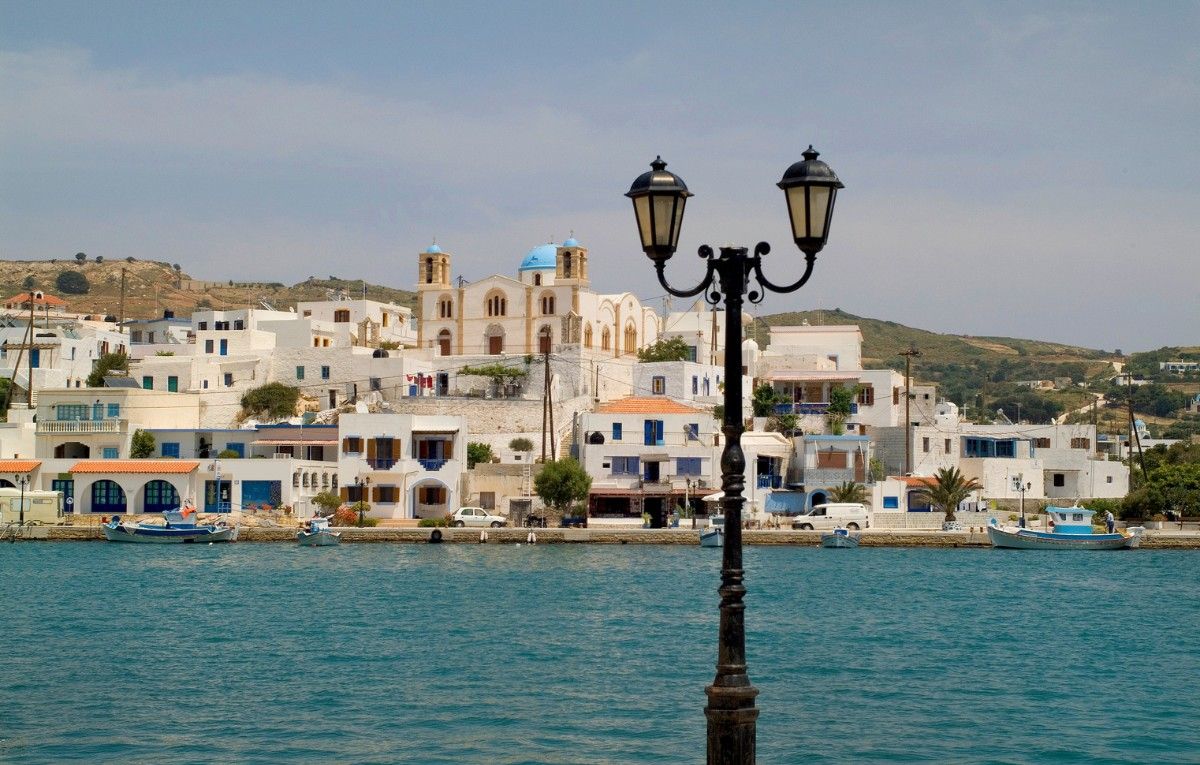 Greece, Lipsi Island, buildings and orthodox church on tiny harbor