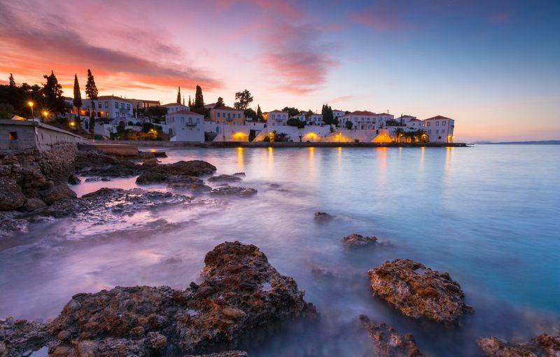 Evening view of Spetses village from the beach, Greece.