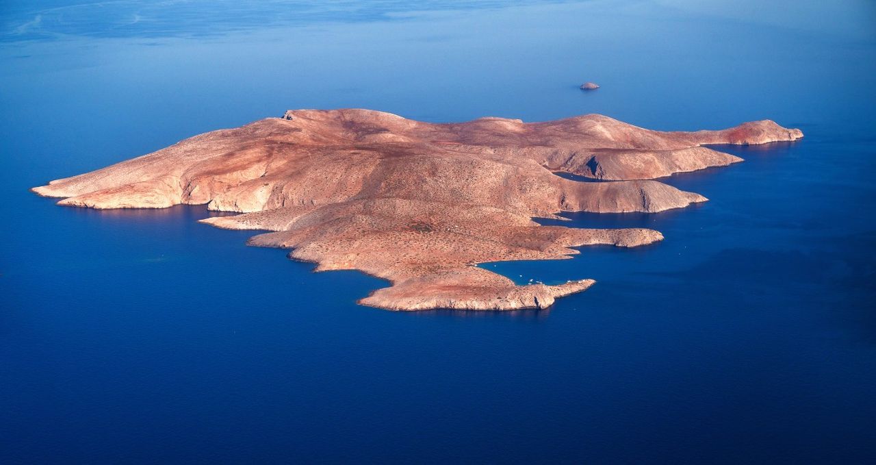 Aerial view to Dia island in blue sea water, Crete.