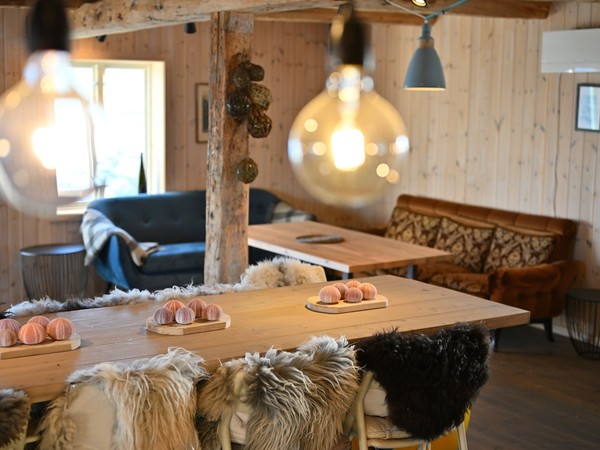 The open dining room and lounge at Lofoten Pier Lodge in Henningsvær.