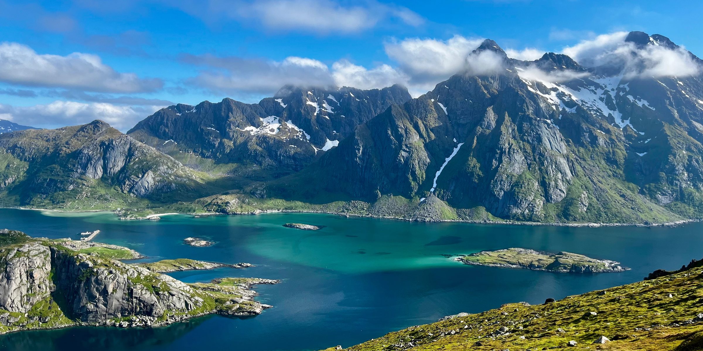 Mountains rising out of the water in Lofoten Norway